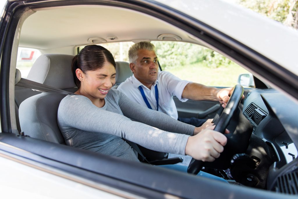 girl learning to drive for the first time