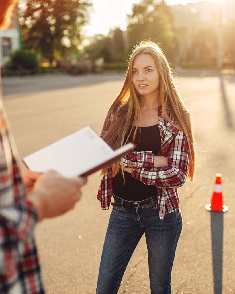 male-instructor-and-female-student-driving-school-REZNS5U.jpg