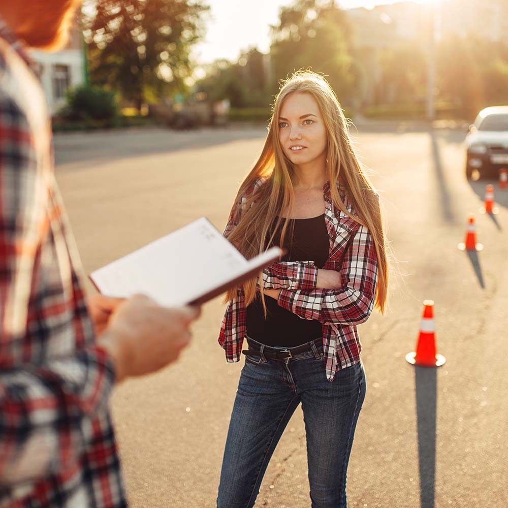 male-instructor-and-female-student-driving-school-REZNS5U.jpg